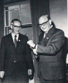 Frank Crawford, editor of the Weekly Times, makes a presentation to Colin Woodfull OBE on his retirement.