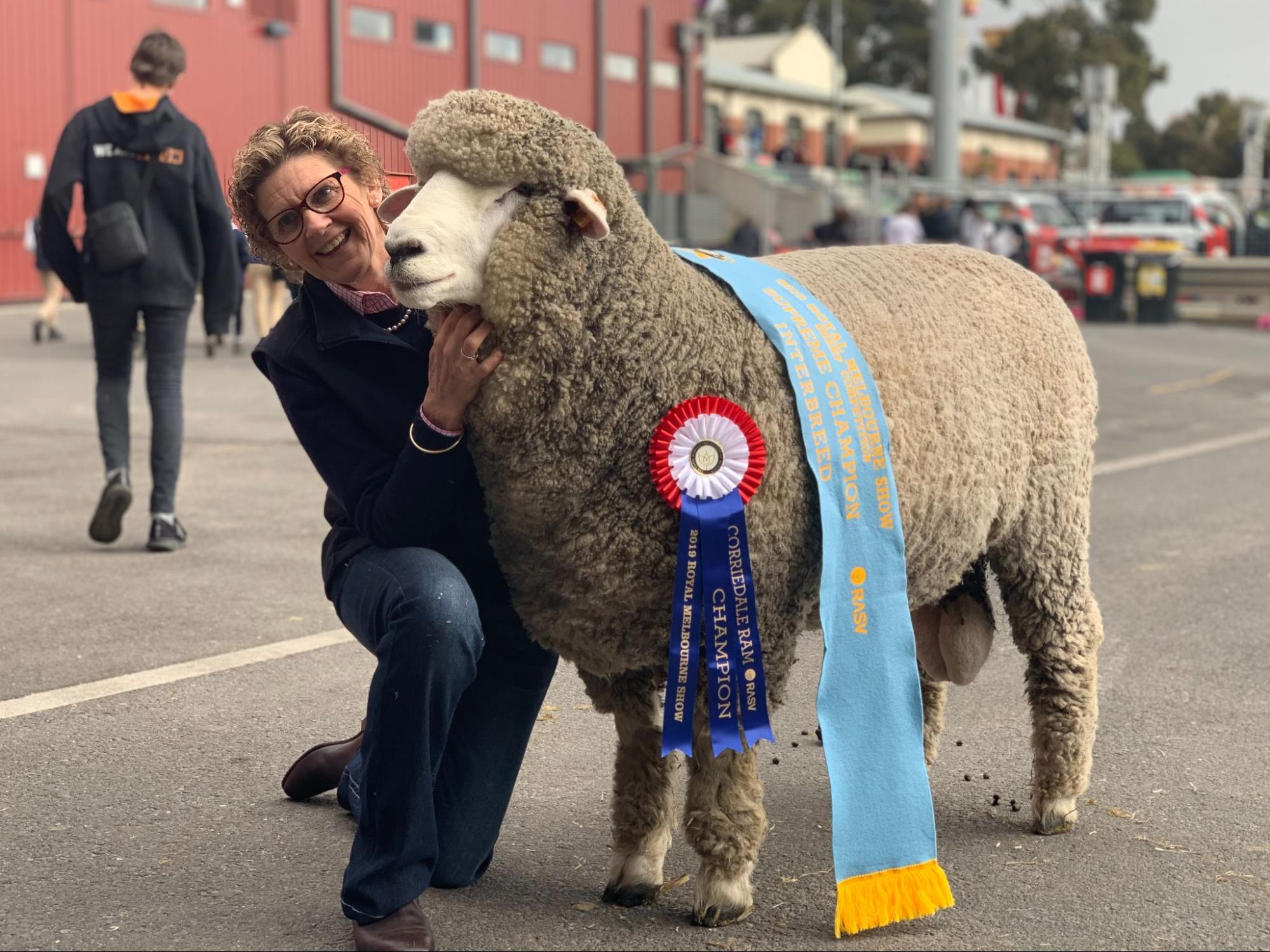 Mrs Ellis in 2019 with Supreme Champion Interbreed Sheep "Buddy".