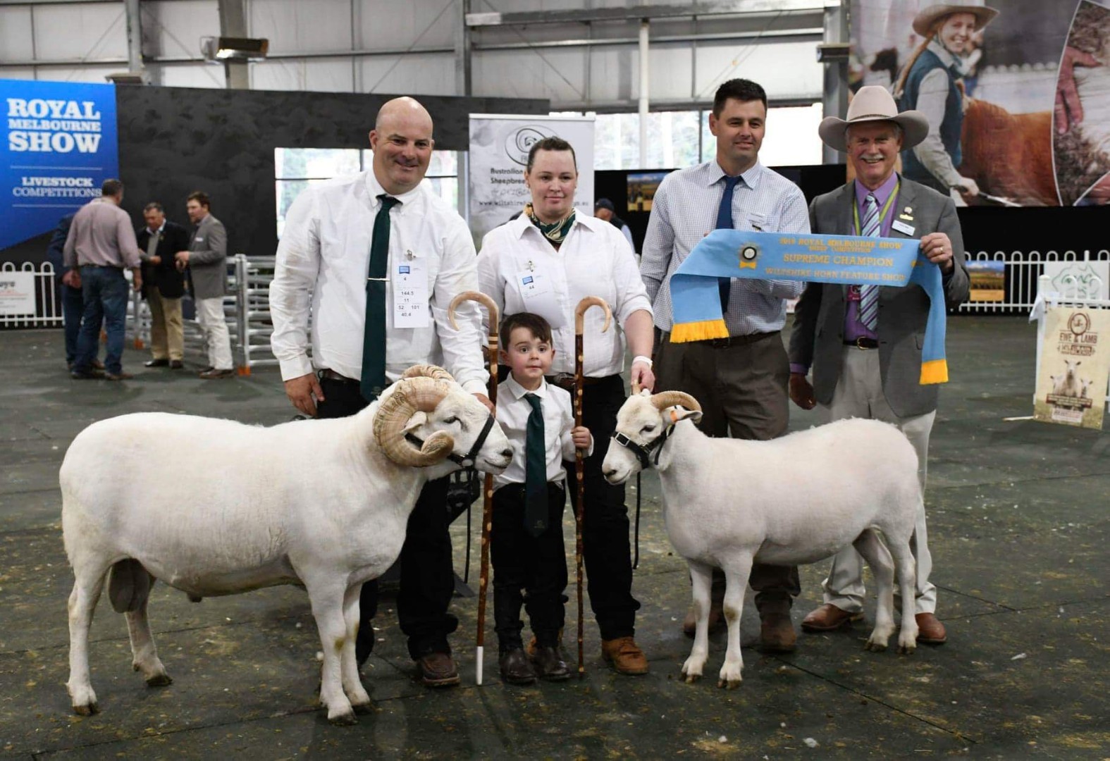Jason O’Loghlin (left) posing with his feature breed supreme exhibit ewe and champion Wiltshire Horn ram at the Royal Melbourne Show in 2019.