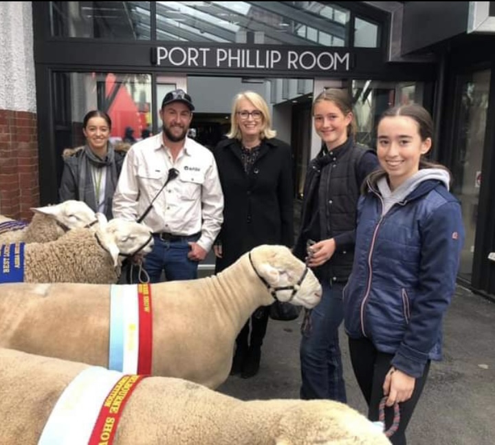 Melbourne Royal’s sheep superintendent Rory Fynch pictured with Lord Mayor of Melbourne, Sally Capp, and Brown family girls with prize winning sheep out the front of the Port Phillip room in preparation for a visit by Victorian Premier Dan Andrews.
